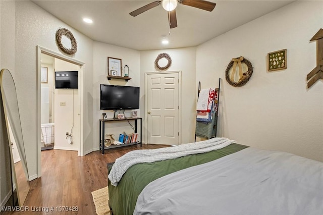 1111 Ridge Dr, Stilwell, OK 74960 - bedroom with wood finished floors, baseboards, and ceiling fan