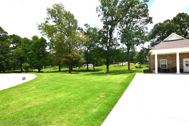 1111 Ridge Dr, Stilwell, OK 74960 - view of green lawn featuring view of scattered trees