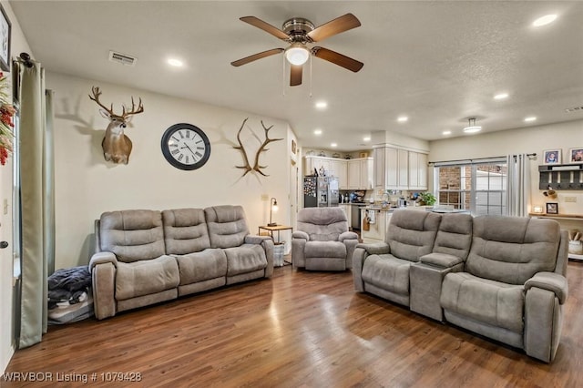 1111 Ridge Dr, Stilwell, OK 74960 - living room with ceiling fan, wood finished floors, and recessed lighting