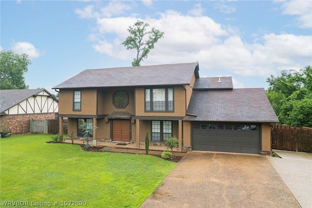 view of front facade with a garage and a front lawn