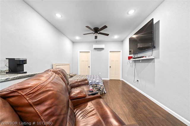 living room featuring ceiling fan, dark hardwood / wood-style flooring, and a wall unit AC