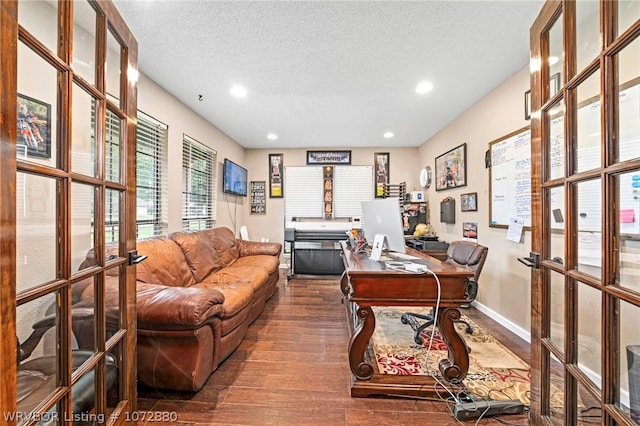 office featuring french doors, a textured ceiling, and hardwood / wood-style floors