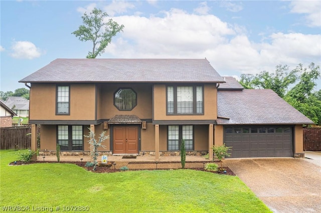 view of front of property with a garage and a front yard