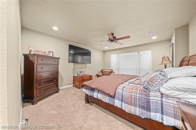 carpeted bedroom with ceiling fan