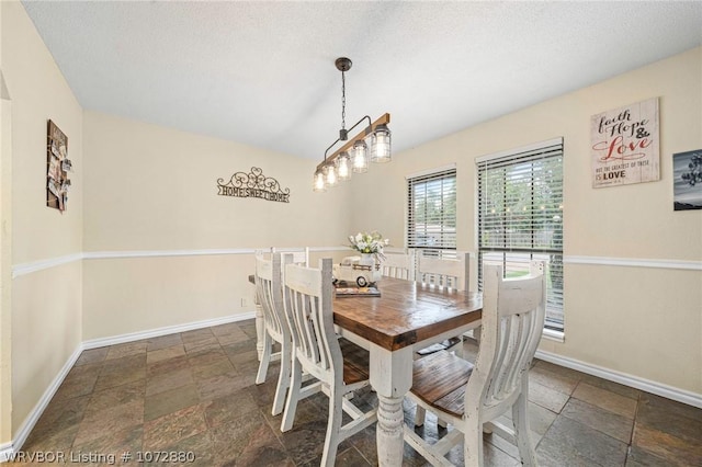 dining room featuring a textured ceiling