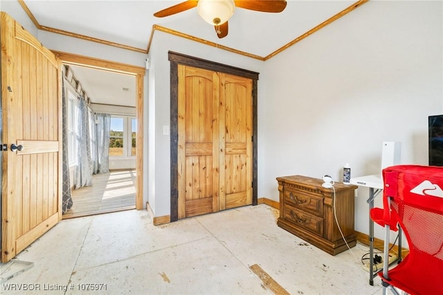 interior space featuring ceiling fan and ornamental molding