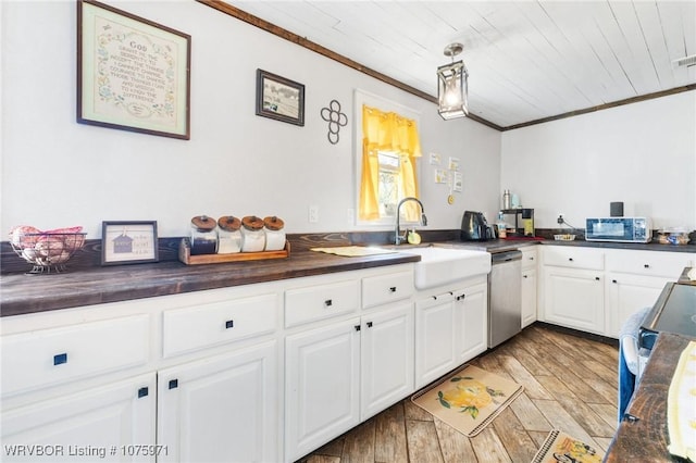 kitchen featuring white cabinets, sink, wooden ceiling, dishwasher, and butcher block countertops