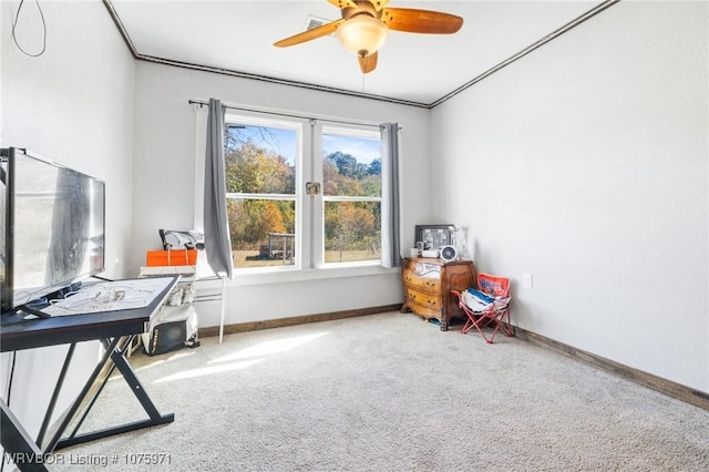 misc room featuring carpet flooring and ceiling fan