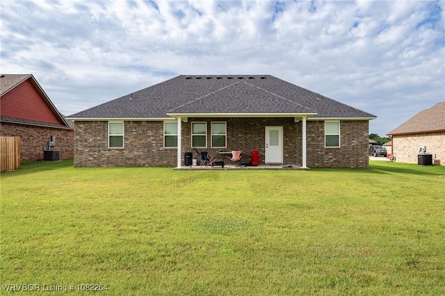 112 Countryside Way, Pocola, OK 74902 - back of property featuring roof with shingles, a lawn, and brick siding