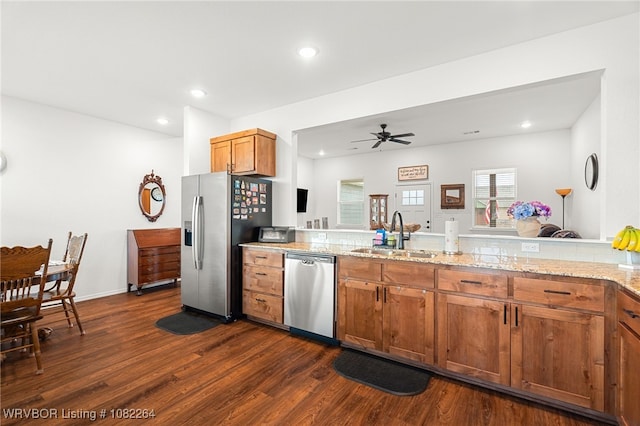 112 Countryside Way, Pocola, OK 74902 - kitchen with appliances with stainless steel finishes, dark wood-style floors, brown cabinets, recessed lighting, and light stone countertops