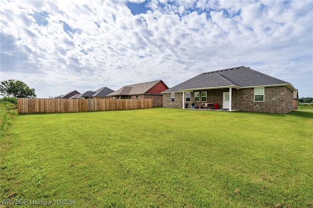 112 Countryside Way, Pocola, OK 74902 - rear view of property featuring brick siding, a patio area, and a shingled roof
