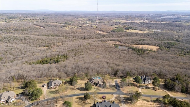 aerial view featuring a view of trees