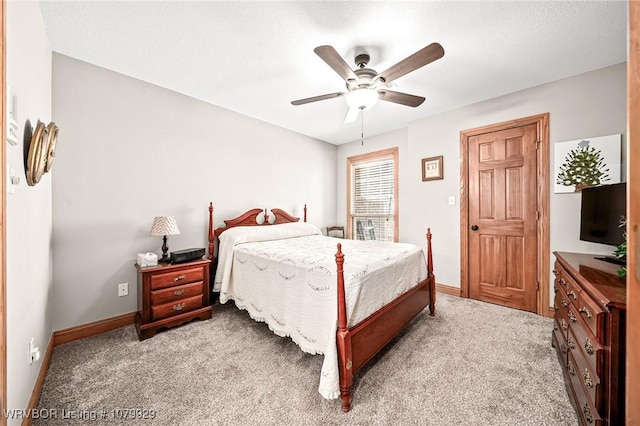 bedroom featuring baseboards, a ceiling fan, and carpet