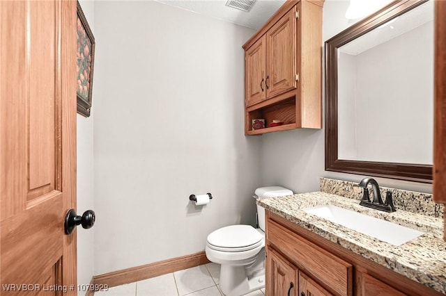 bathroom with tile patterned flooring, visible vents, toilet, vanity, and baseboards