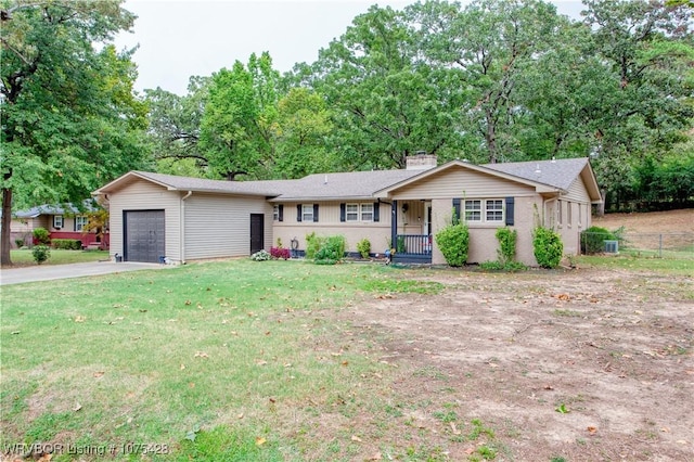 single story home featuring a garage and a front yard