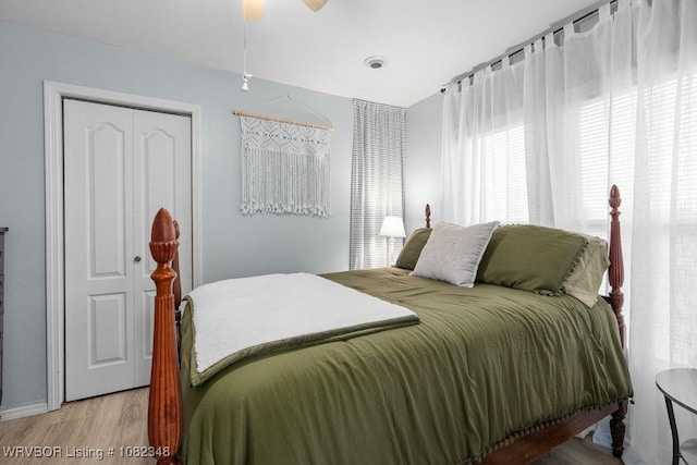 627 Parks Dr, Charleston, AR 72933 - bedroom with wood finished floors and ceiling fan
