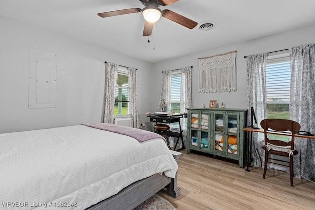 627 Parks Dr, Charleston, AR 72933 - bedroom featuring wood finished floors, electric panel, and ceiling fan