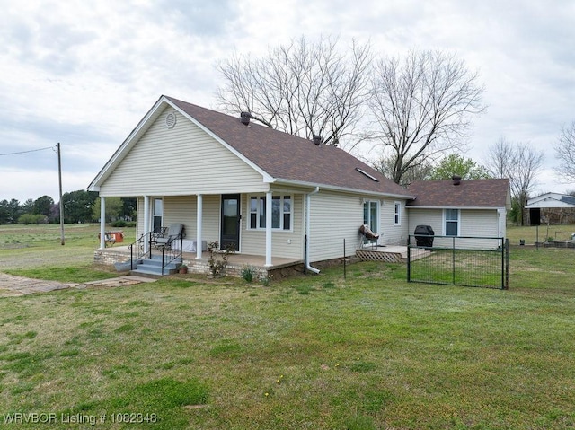 627 Parks Dr, Charleston, AR 72933 - back of property featuring a porch, a shingled roof, and a gate