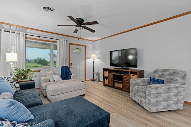 627 Parks Dr, Charleston, AR 72933 - living room with ornamental molding, ceiling fan, and wood finished floors