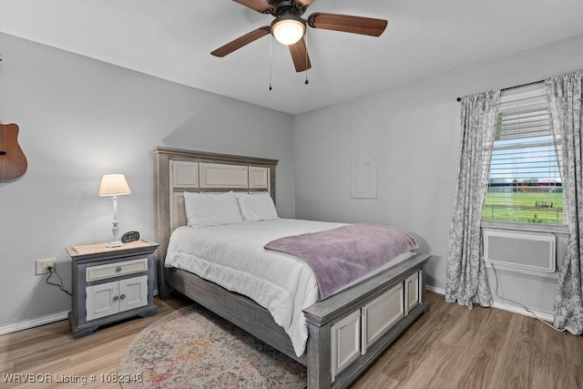 627 Parks Dr, Charleston, AR 72933 - bedroom with light wood-type flooring and ceiling fan