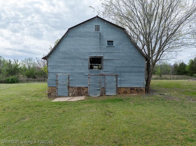 627 Parks Dr, Charleston, AR 72933 - back of house featuring a lawn