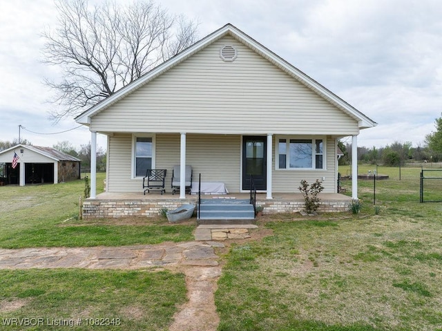 627 Parks Dr, Charleston, AR 72933 - view of front facade featuring a porch and an outbuilding