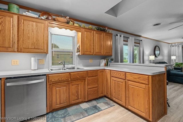 627 Parks Dr, Charleston, AR 72933 - kitchen featuring stainless steel dishwasher, ornamental molding, open floor plan, a peninsula, and light wood-style floors