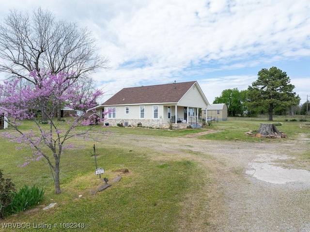 627 Parks Dr, Charleston, AR 72933 - single story home featuring covered porch, driveway, and a front lawn