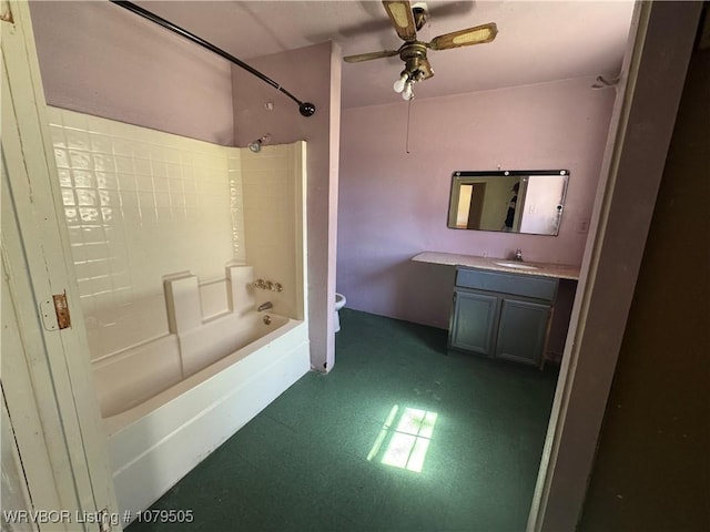 bathroom featuring tile patterned floors, toilet, a ceiling fan, shower / bath combination, and vanity