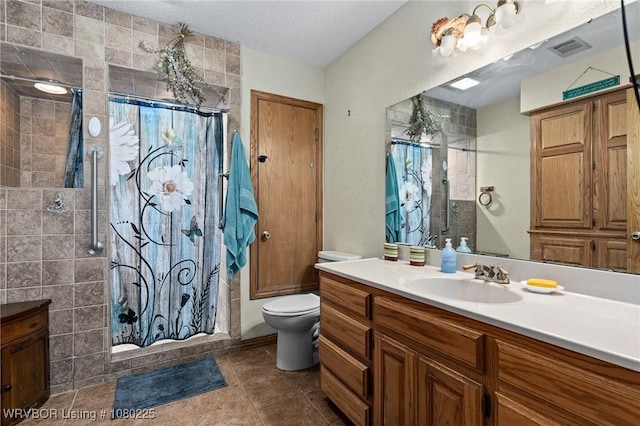 full bath featuring visible vents, toilet, a shower stall, and vanity