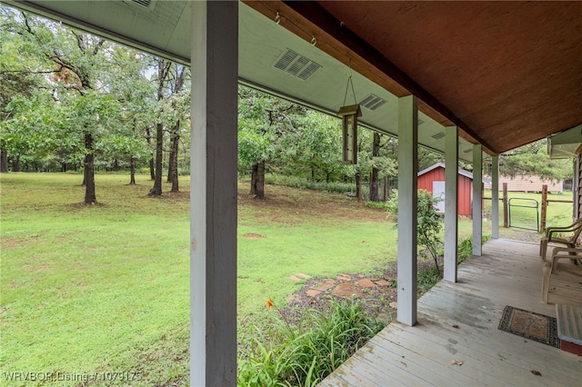 view of yard with a storage shed and an outdoor structure