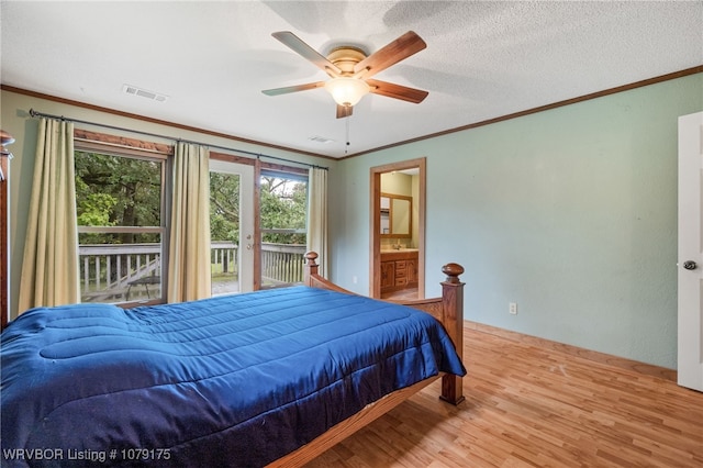 bedroom featuring access to exterior, light wood-style flooring, visible vents, and crown molding