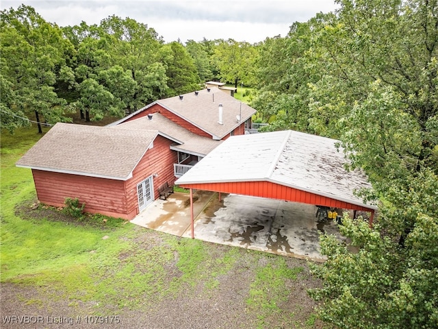 birds eye view of property with a forest view