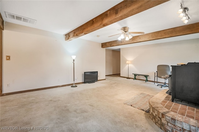 unfurnished living room with light colored carpet, beam ceiling, visible vents, and baseboards