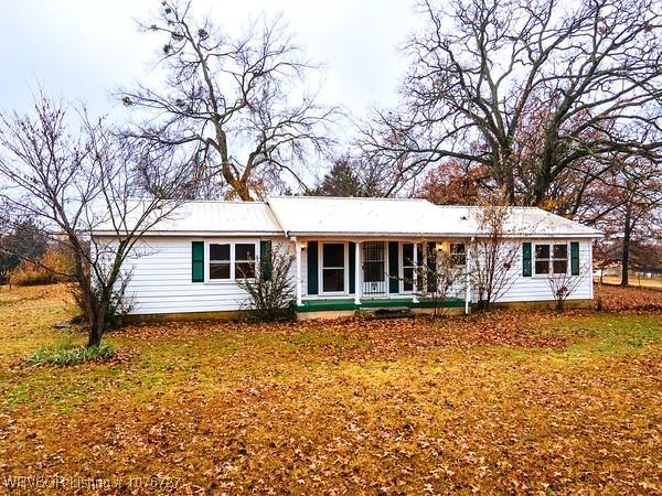 back of house with covered porch