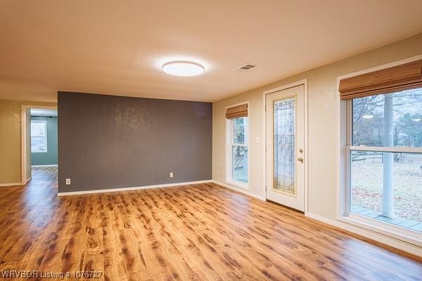 empty room with light wood-type flooring