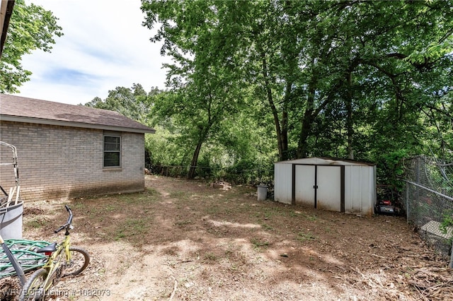 1008 Pattie Ln, Barling, AR 72923 - fenced backyard with a shed