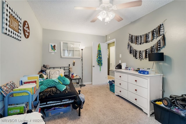 1008 Pattie Ln, Barling, AR 72923 - bedroom featuring carpet flooring, a textured ceiling, and a ceiling fan