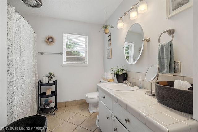 1008 Pattie Ln, Barling, AR 72923 - full bathroom featuring vanity, tile patterned floors, and backsplash