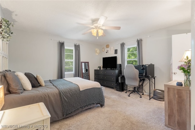 1008 Pattie Ln, Barling, AR 72923 - bedroom with multiple windows, light carpet, and ceiling fan
