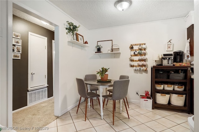 1008 Pattie Ln, Barling, AR 72923 - dining space with a textured ceiling and light tile patterned floors