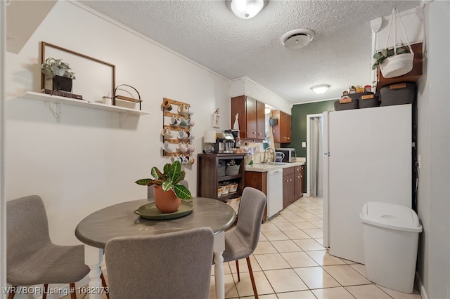 1008 Pattie Ln, Barling, AR 72923 - dining space with a textured ceiling and light tile patterned floors