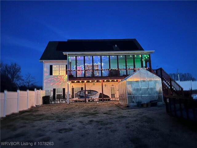 21 Bermuda Ct, Mountain Home, AR 72653 - back of house at night with an exterior structure
