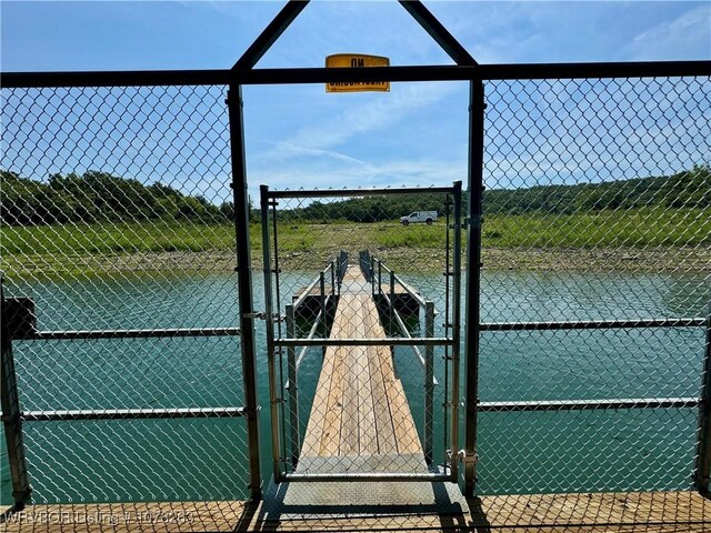 21 Bermuda Ct, Mountain Home, AR 72653 - view of tennis court with a gate and a water view