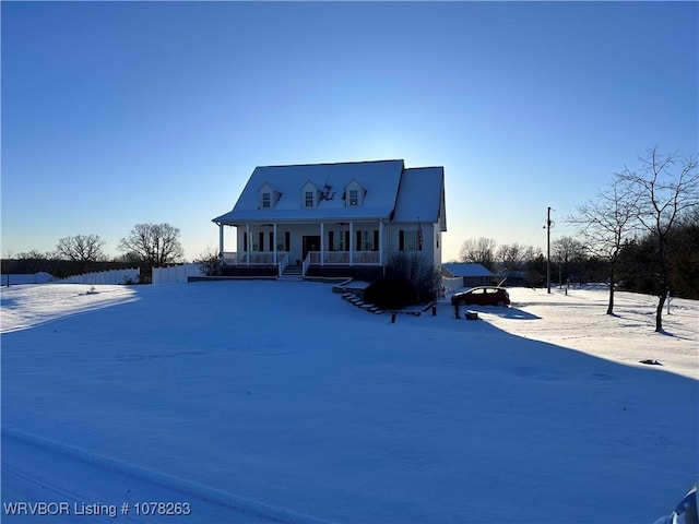 cape cod home with a porch