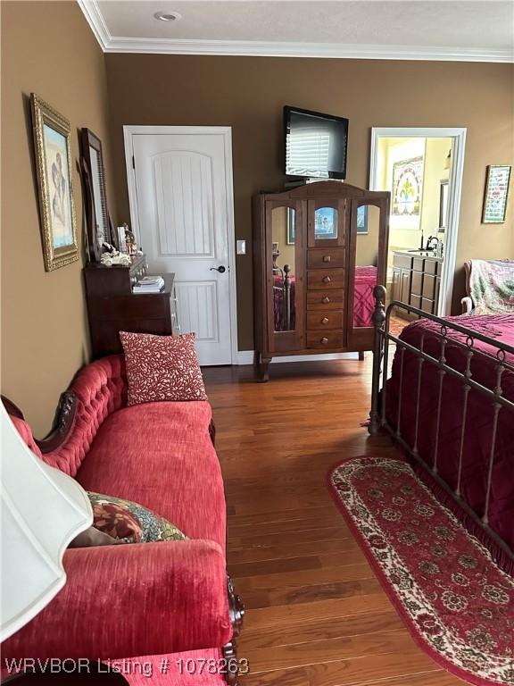 21 Bermuda Ct, Mountain Home, AR 72653 - bedroom with ornamental molding and wood finished floors