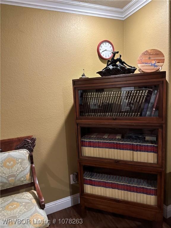 bedroom featuring crown molding and wood-type flooring