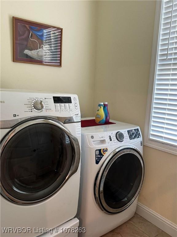 21 Bermuda Ct, Mountain Home, AR 72653 - laundry room featuring independent washer and dryer, light tile patterned flooring, and baseboards