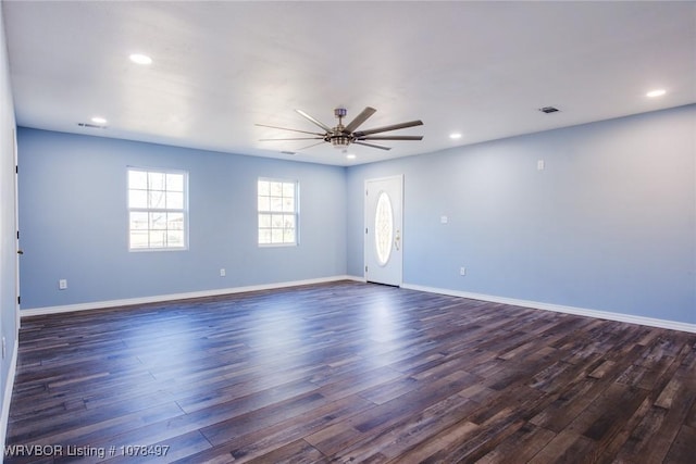 empty room featuring ceiling fan and dark hardwood / wood-style flooring