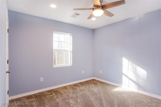 empty room with carpet floors and ceiling fan